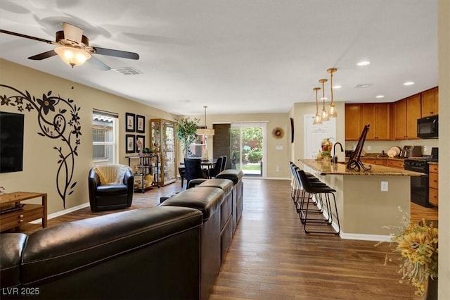 759 Star Apple Ln, Las Vegas, NV 89178 - living area with dark wood-style floors, baseboards, recessed lighting, and a ceiling fan