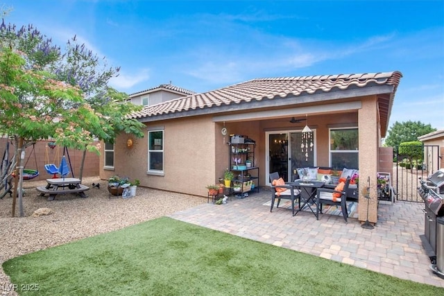 759 Star Apple Ln, Las Vegas, NV 89178 - rear view of house featuring stucco siding, a patio area, a tile roof, and outdoor lounge area