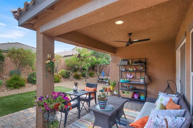 759 Star Apple Ln, Las Vegas, NV 89178 - fenced backyard featuring a patio, an outdoor living space, and a ceiling fan