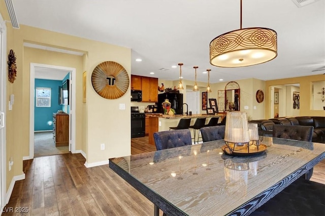 759 Star Apple Ln, Las Vegas, NV 89178 - dining space featuring dark wood-style flooring, baseboards, and recessed lighting