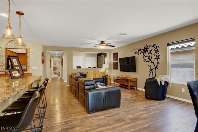 759 Star Apple Ln, Las Vegas, NV 89178 - living area with light wood-style floors, ceiling fan, and baseboards