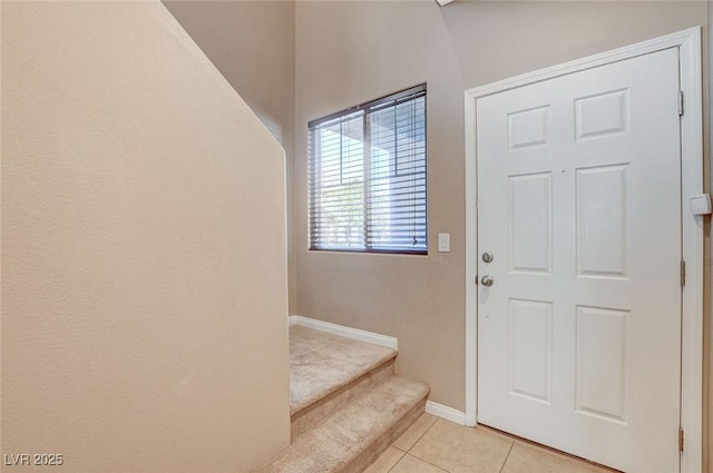 7963 Cape Brett St, Las Vegas, NV 89131 - entryway with light tile patterned flooring, baseboards, and stairs