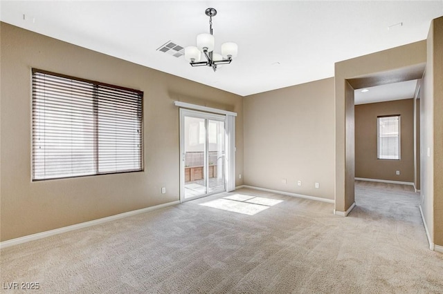 7963 Cape Brett St, Las Vegas, NV 89131 - carpeted empty room with a chandelier and baseboards