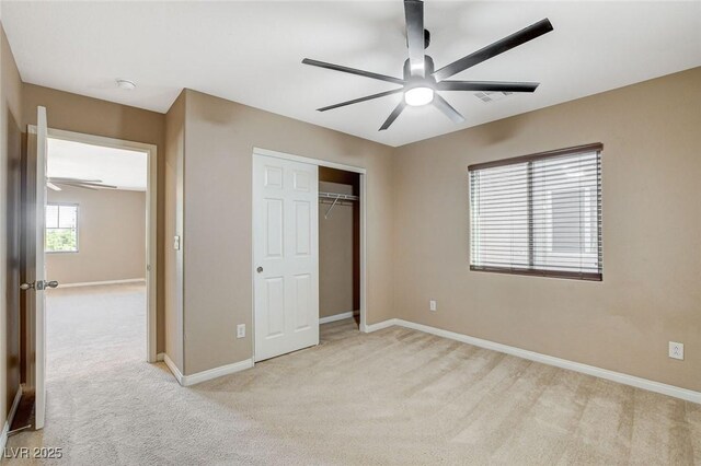 7963 Cape Brett St, Las Vegas, NV 89131 - unfurnished bedroom featuring light carpet, baseboards, a closet, and ceiling fan