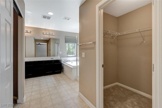 7963 Cape Brett St, Las Vegas, NV 89131 - full bath featuring a bath, a spacious closet, vanity, an enclosed shower, and baseboards
