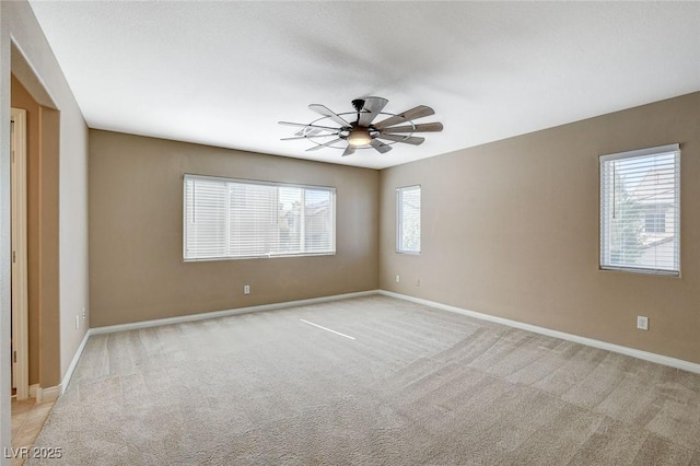 7963 Cape Brett St, Las Vegas, NV 89131 - spare room featuring a ceiling fan, light colored carpet, and baseboards