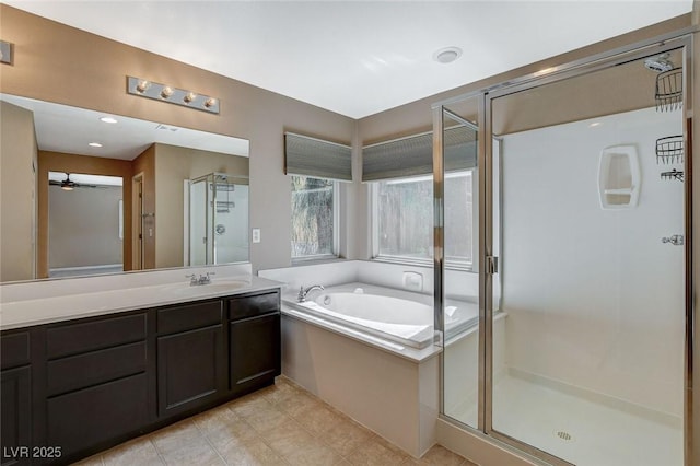 7963 Cape Brett St, Las Vegas, NV 89131 - bathroom featuring a shower stall, a bath, vanity, ceiling fan, and tile patterned floors