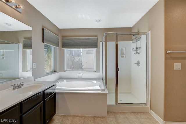 7963 Cape Brett St, Las Vegas, NV 89131 - bathroom featuring vanity, a stall shower, a garden tub, and tile patterned flooring