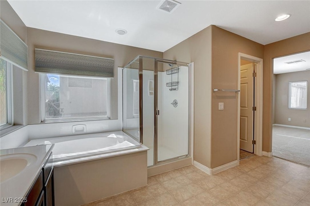 7963 Cape Brett St, Las Vegas, NV 89131 - full bathroom with a stall shower, a garden tub, vanity, and baseboards