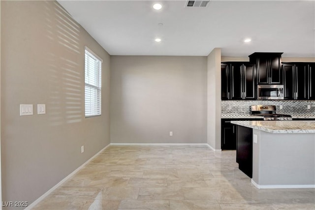 4 Lomita Heights Dr, Las Vegas, NV 89138 - kitchen with appliances with stainless steel finishes, dark cabinets, backsplash, baseboards, and recessed lighting