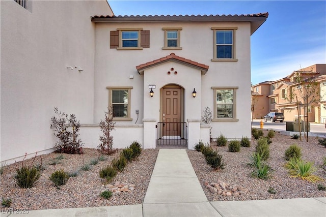4 Lomita Heights Dr, Las Vegas, NV 89138 - mediterranean / spanish home featuring stucco siding, a gate, and a tile roof