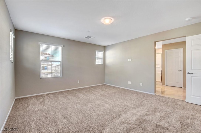 4 Lomita Heights Dr, Las Vegas, NV 89138 - spare room featuring light carpet, healthy amount of natural light, and baseboards