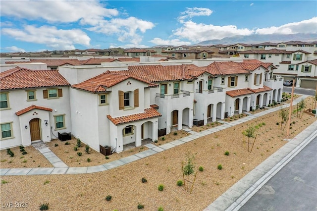 4 Lomita Heights Dr, Las Vegas, NV 89138 - view of front of home with a residential view, stucco siding, and a tile roof