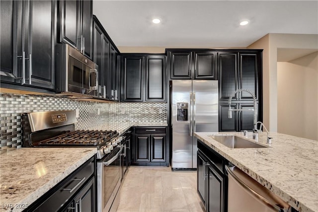 4 Lomita Heights Dr, Las Vegas, NV 89138 - kitchen featuring appliances with stainless steel finishes, dark cabinetry, a sink, and recessed lighting