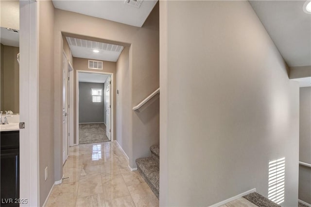 4 Lomita Heights Dr, Las Vegas, NV 89138 - hallway featuring light marble finish floors, baseboards, and stairway