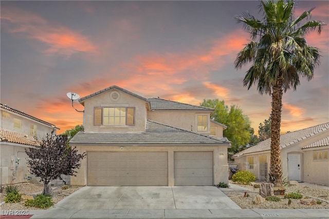 1906 Desert Sage Ave, North Las Vegas, NV 89031 - traditional-style home featuring stucco siding, concrete driveway, an attached garage, and a tiled roof