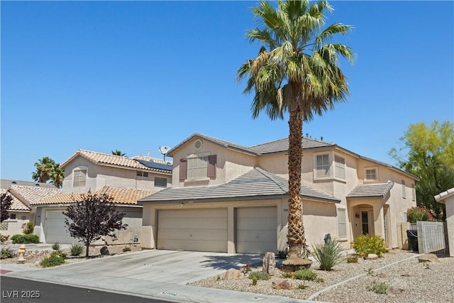1906 Desert Sage Ave, North Las Vegas, NV 89031 - traditional home featuring a garage, concrete driveway, and stucco siding