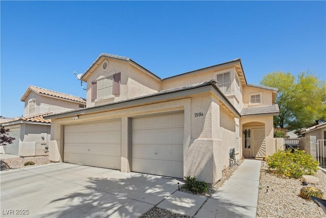 1906 Desert Sage Ave, North Las Vegas, NV 89031 - view of front of property with stucco siding, concrete driveway, and an attached garage
