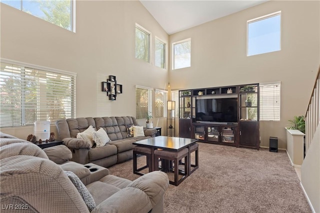 1906 Desert Sage Ave, North Las Vegas, NV 89031 - carpeted living area with a towering ceiling and baseboards