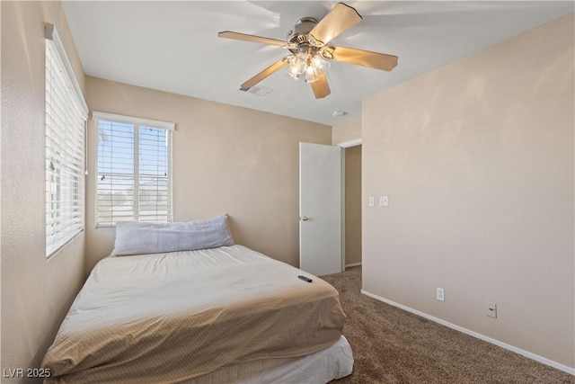 1906 Desert Sage Ave, North Las Vegas, NV 89031 - carpeted bedroom with a ceiling fan and baseboards