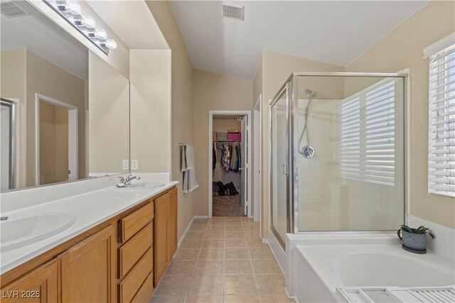 1906 Desert Sage Ave, North Las Vegas, NV 89031 - bathroom featuring a stall shower, a bath, double vanity, and tile patterned floors