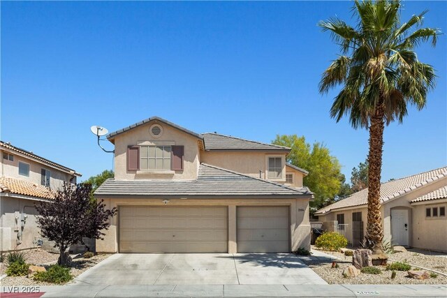 1906 Desert Sage Ave, North Las Vegas, NV 89031 - traditional home featuring stucco siding, concrete driveway, an attached garage, and a tiled roof