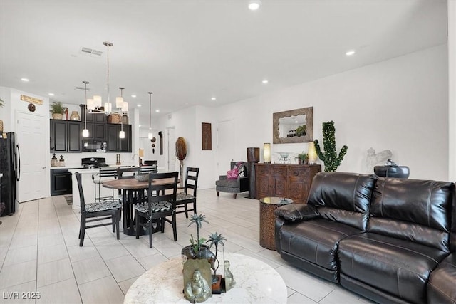 676 Otter Brook St, Henderson, NV 89011 - living room with recessed lighting, a chandelier, and light tile patterned floors