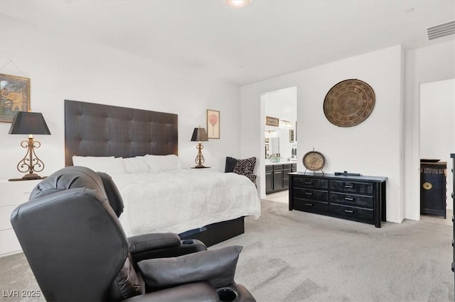 676 Otter Brook St, Henderson, NV 89011 - bedroom with light colored carpet and ensuite bath