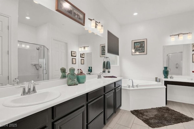 676 Otter Brook St, Henderson, NV 89011 - bathroom with a stall shower, double vanity, a garden tub, tile patterned floors, and recessed lighting