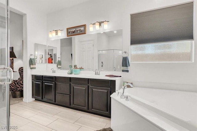 676 Otter Brook St, Henderson, NV 89011 - full bath with double vanity, a bath, and a stall shower
