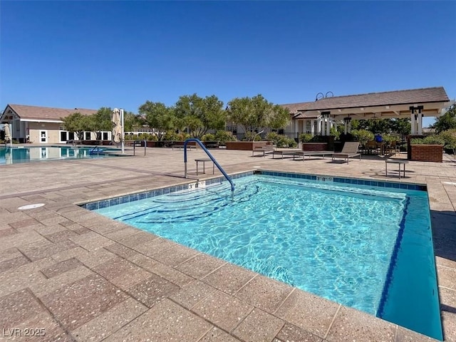 676 Otter Brook St, Henderson, NV 89011 - community pool featuring a patio area