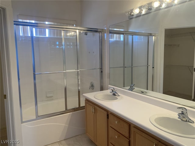 10357 Bent Willow Ave, Las Vegas, NV 89129 - full bathroom with shower / bath combination with glass door, double vanity, tile patterned flooring, and a walk in closet