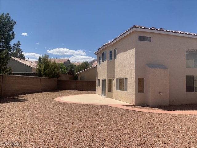 10357 Bent Willow Ave, Las Vegas, NV 89129 - rear view of property with stucco siding, a patio area, and a fenced backyard