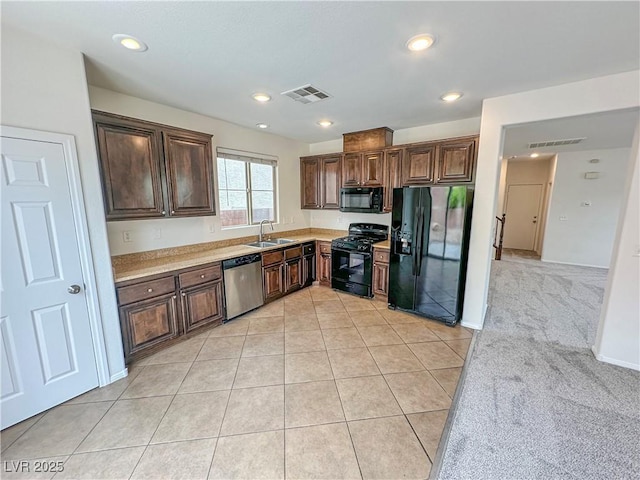 7815 Shingle Beach St, Las Vegas, NV 89166 - kitchen with black appliances, a sink, light countertops, dark brown cabinetry, and recessed lighting