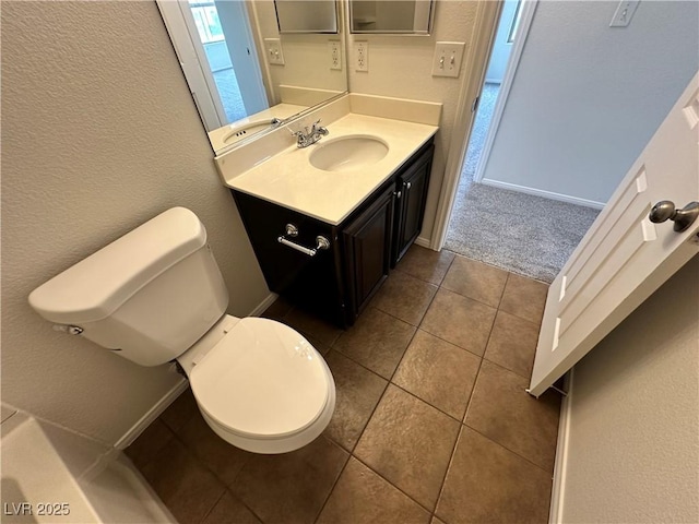 7815 Shingle Beach St, Las Vegas, NV 89166 - bathroom featuring vanity, toilet, a textured wall, and tile patterned floors