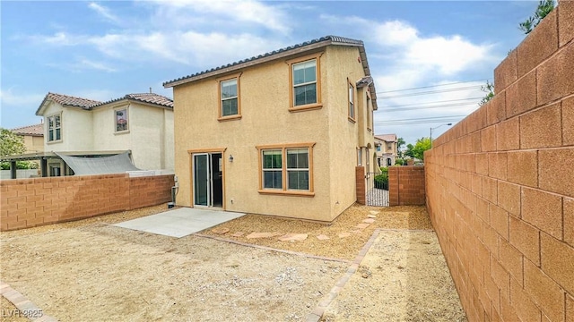 7815 Shingle Beach St, Las Vegas, NV 89166 - rear view of house with stucco siding, a fenced backyard, and a patio