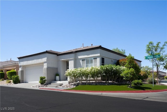 10532 Redwood Ash Ave, Las Vegas, NV 89144 - view of front of home with stucco siding and an attached garage