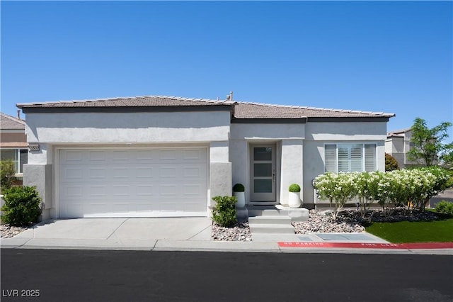 10532 Redwood Ash Ave, Las Vegas, NV 89144 - view of front of home featuring concrete driveway, stucco siding, and a garage
