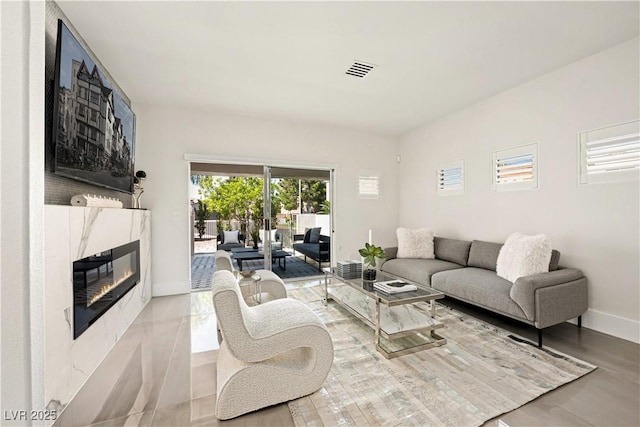 10532 Redwood Ash Ave, Las Vegas, NV 89144 - living room with baseboards and a fireplace