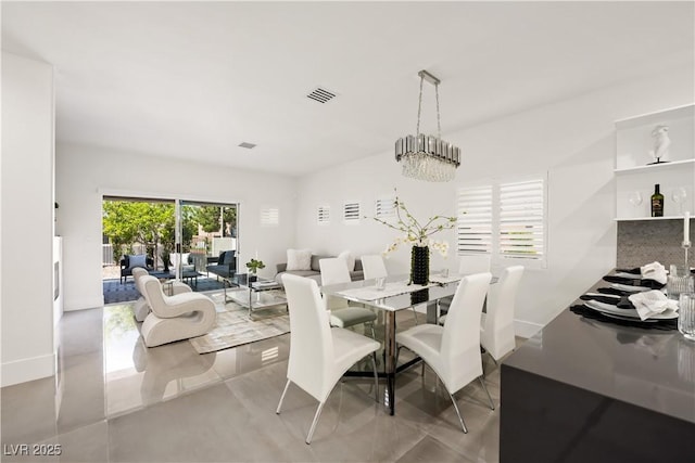 10532 Redwood Ash Ave, Las Vegas, NV 89144 - tiled dining area featuring baseboards