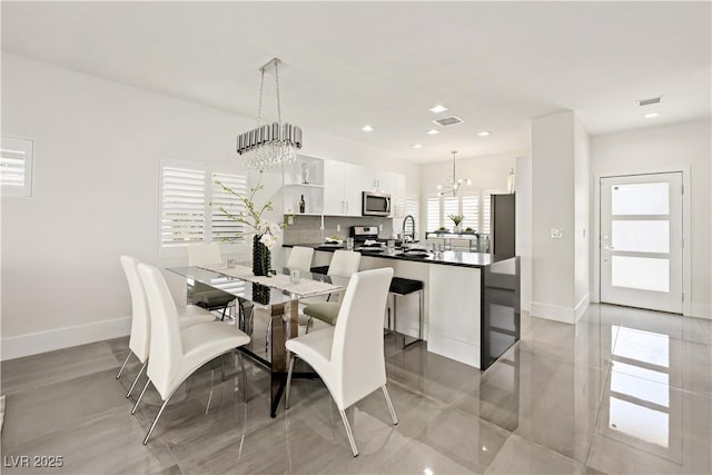 10532 Redwood Ash Ave, Las Vegas, NV 89144 - dining area featuring a chandelier, recessed lighting, and light tile patterned floors