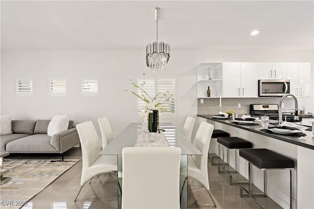 10532 Redwood Ash Ave, Las Vegas, NV 89144 - dining area with a chandelier