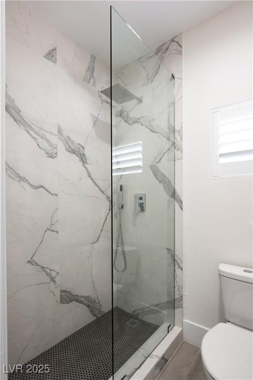 10532 Redwood Ash Ave, Las Vegas, NV 89144 - bathroom featuring a marble finish shower and toilet