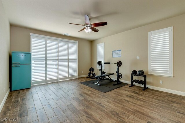 6403 Brandon Hills Ct, Las Vegas, NV 89139 - exercise room featuring a ceiling fan, wood finished floors, and baseboards
