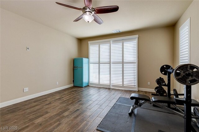 6403 Brandon Hills Ct, Las Vegas, NV 89139 - workout area with wood finished floors, ceiling fan, and baseboards