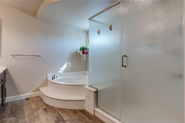 6403 Brandon Hills Ct, Las Vegas, NV 89139 - bathroom featuring a bath, vanity, a shower stall, and wood finished floors