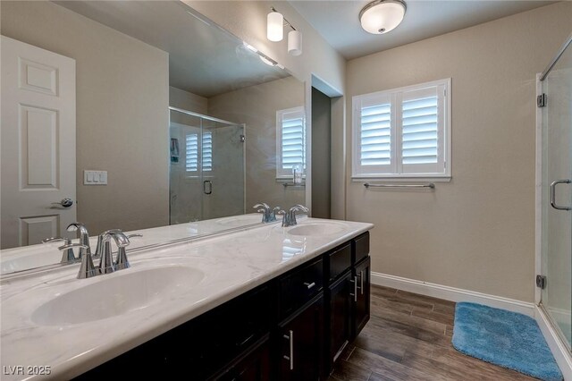 6403 Brandon Hills Ct, Las Vegas, NV 89139 - bathroom with a stall shower, double vanity, and wood finished floors