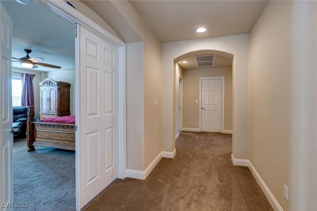 6403 Brandon Hills Ct, Las Vegas, NV 89139 - hallway with carpet flooring, arched walkways, baseboards, and recessed lighting