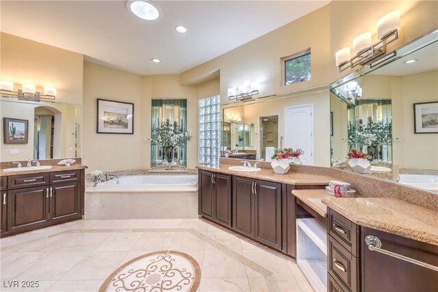 5162 Estasi St, Las Vegas, NV 89135 - bathroom with a bath, two vanities, tile patterned flooring, and recessed lighting