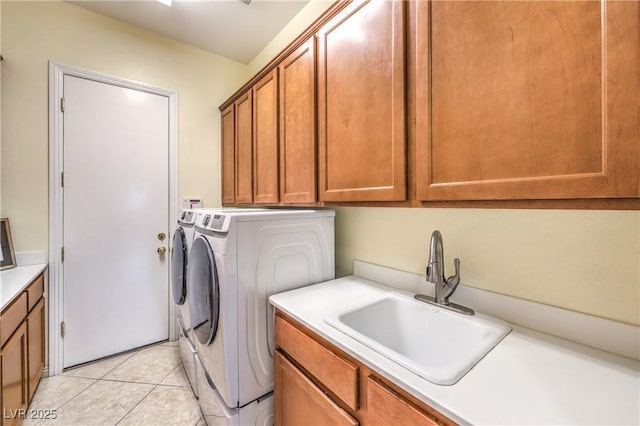 5162 Estasi St, Las Vegas, NV 89135 - laundry area featuring washer and clothes dryer, cabinet space, and light tile patterned floors